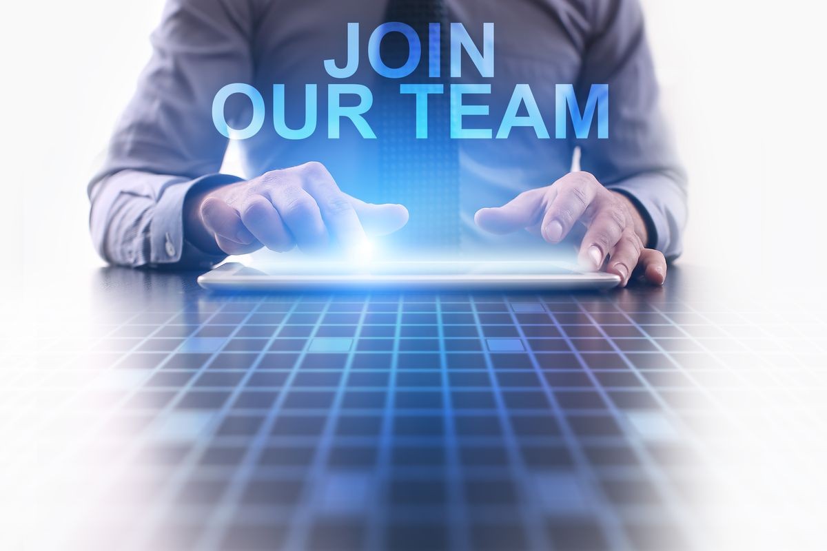 Businessman using tablet pc and select Join our team.