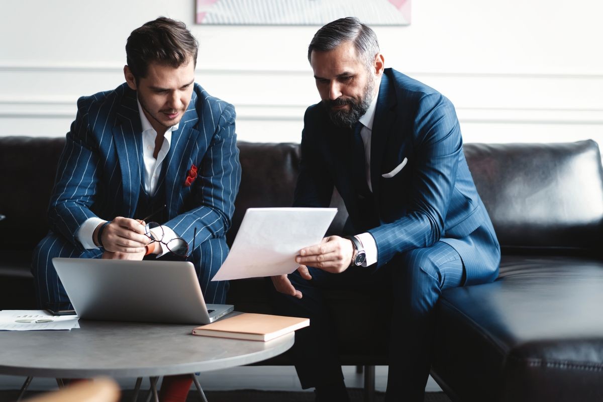 Business executives discussing work, developing strategy for online business, explaining sharing ideas, preparing presentation, having brainstorming session at office.